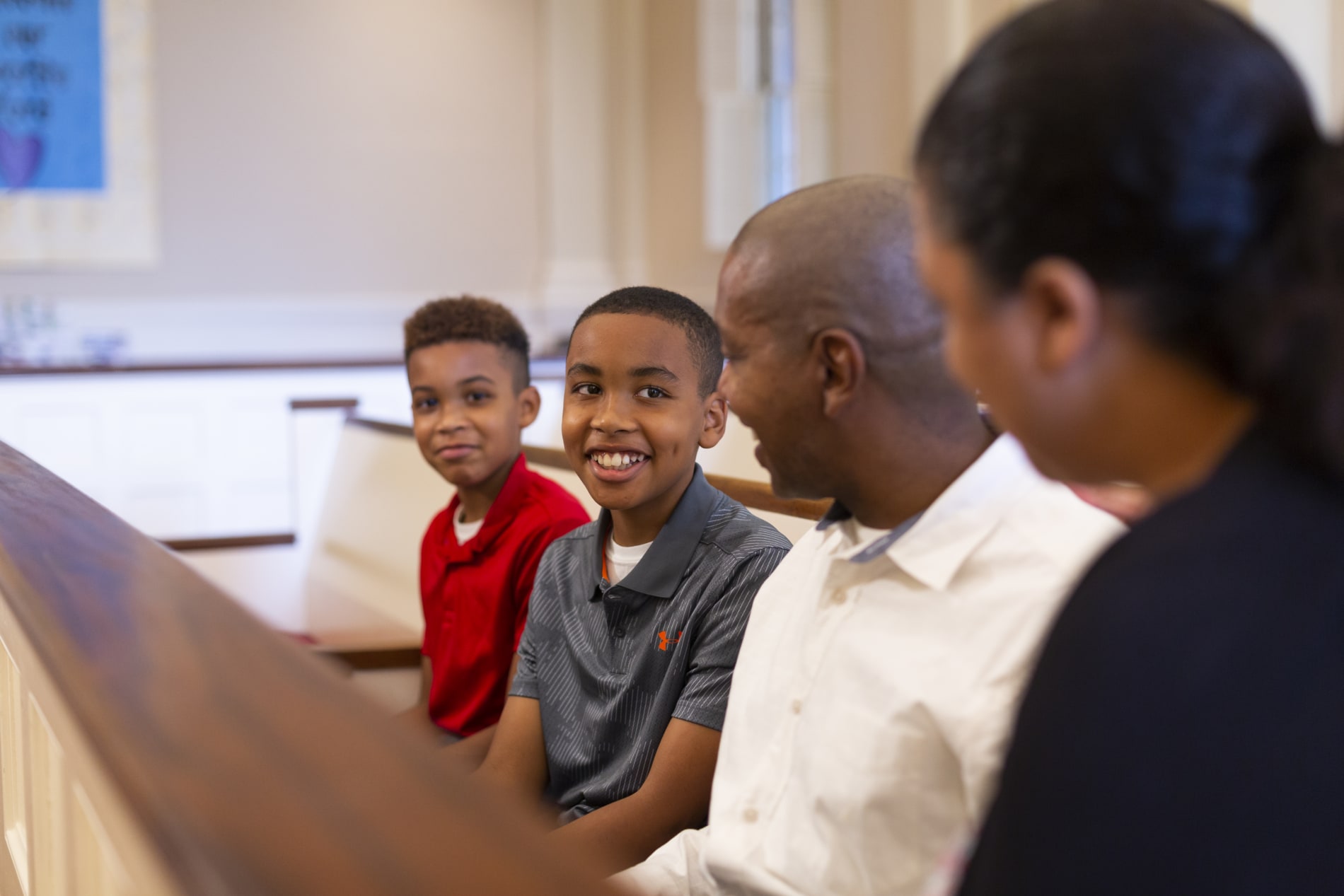 Family in pew in church